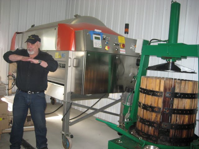 Owner Jim Bogady explains the press process