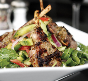 Boulevard Woodgrill’s pesto-rubbed lamb chops are on the bone and off the hook. 