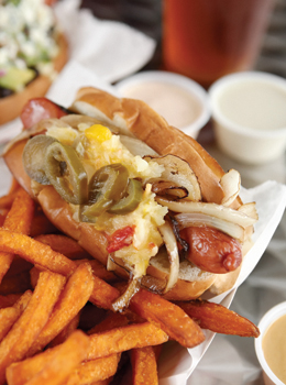 Hand-cut fries and spicy sauces complete the meal.