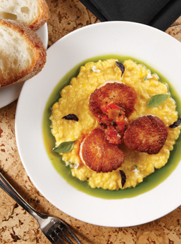 Tallula Chef Koslow sends seared scallops for a dip in basil-oil framed polenta.