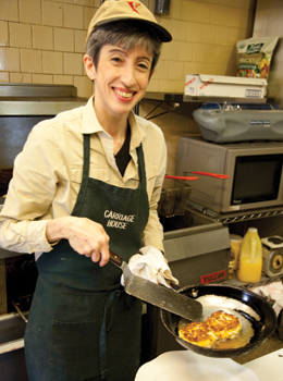 Janet Saedi lends a hand in the Carriage House kitchen.
