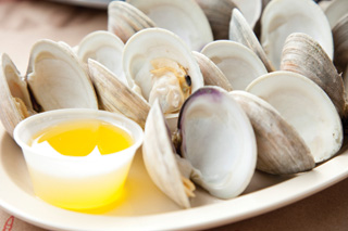 Steamed clams await their turn in a bath of drawn butter 