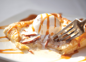 Peach tart with vanilla bean ice cream and a drizzle of caramel Peach tart with vanilla bean ice cream and a drizzle of caramel