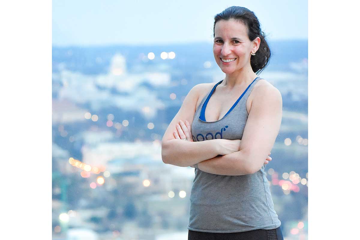 woman with arms crossed and good sweat tank