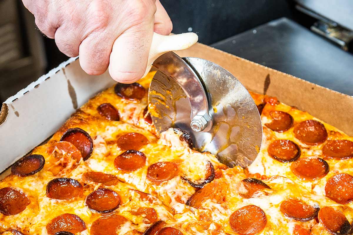 old dominion pizza being cut