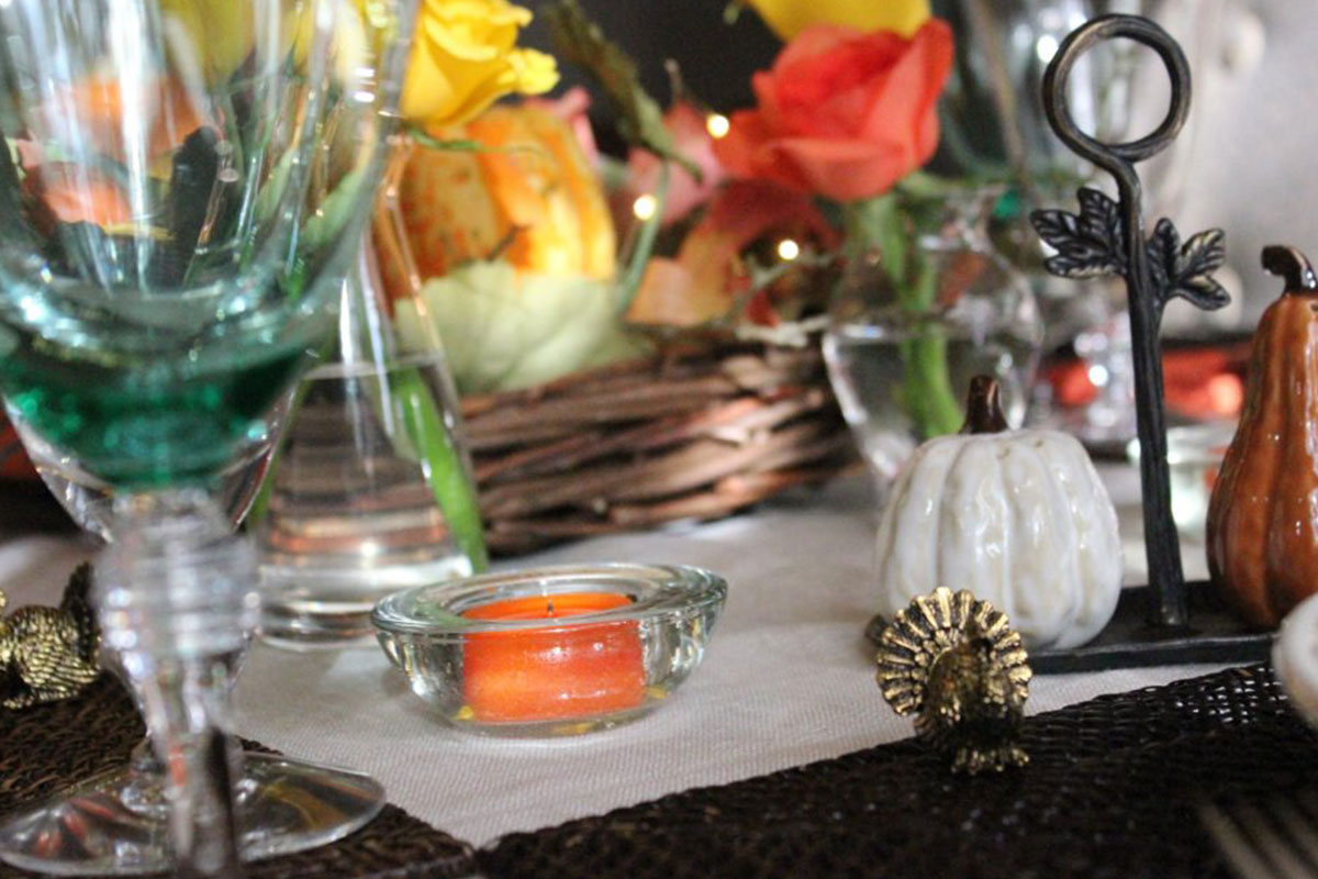 zoom in on candle, flower on table