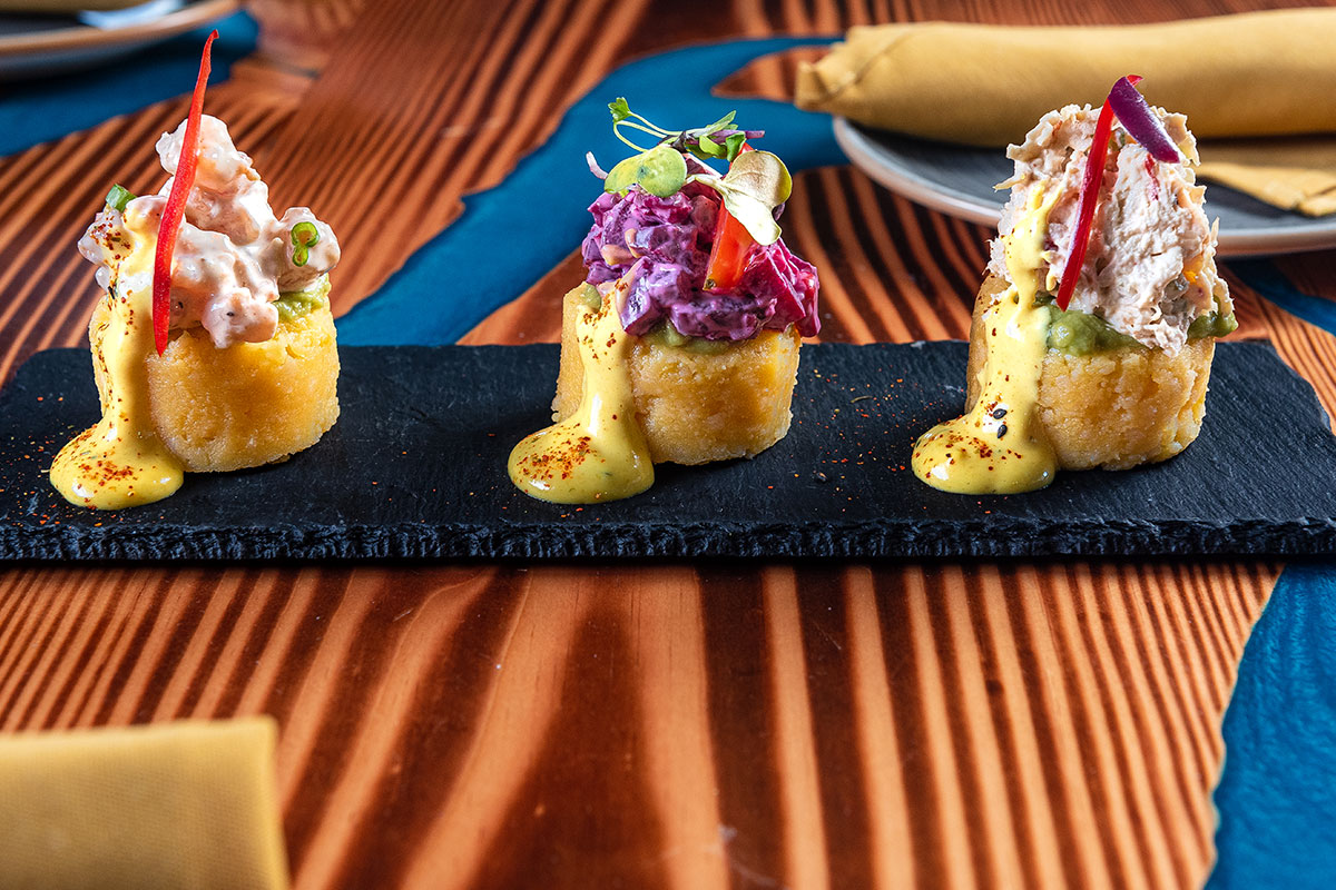 three pieces of food with crab