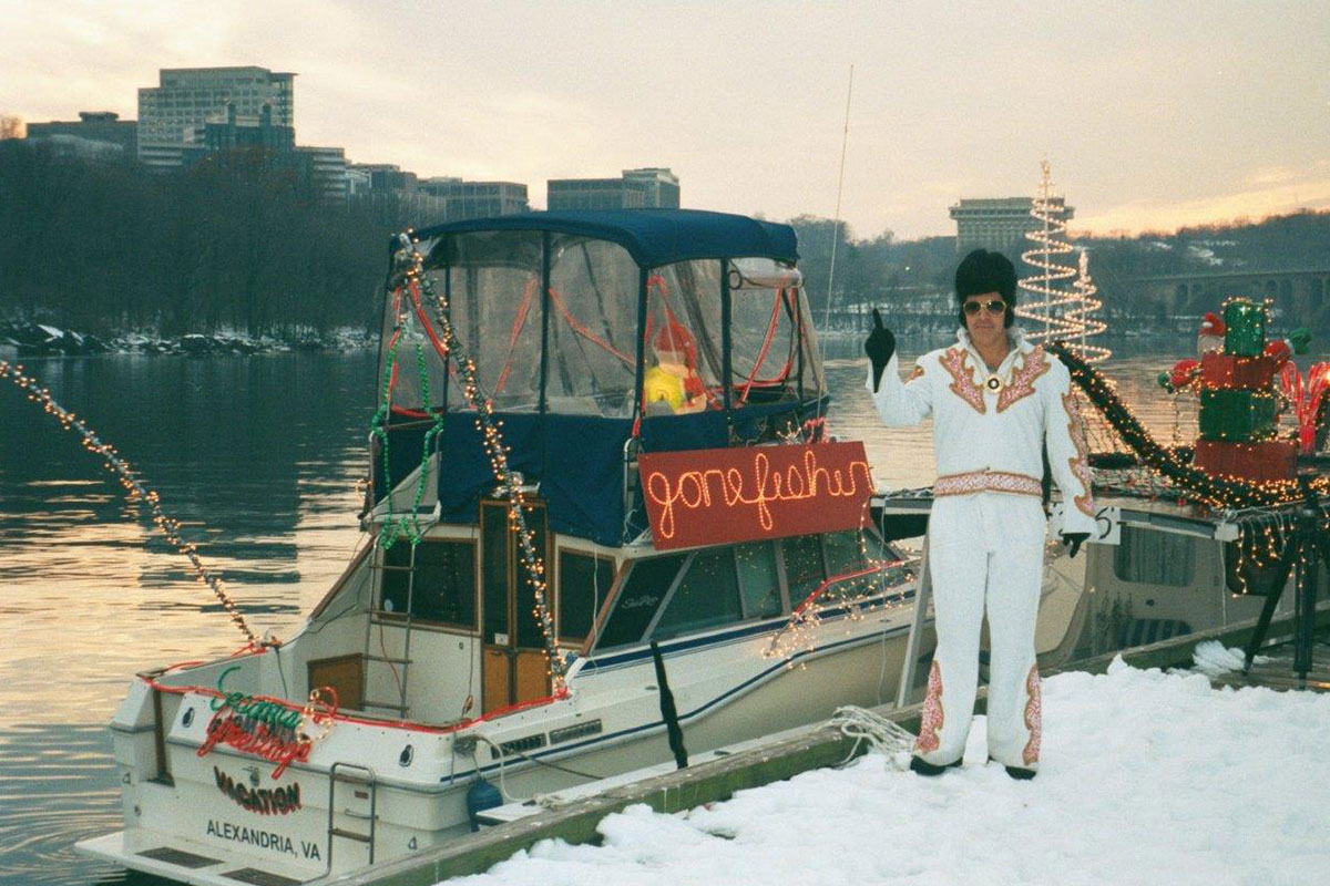 jay atkinson in elvis costume by boat