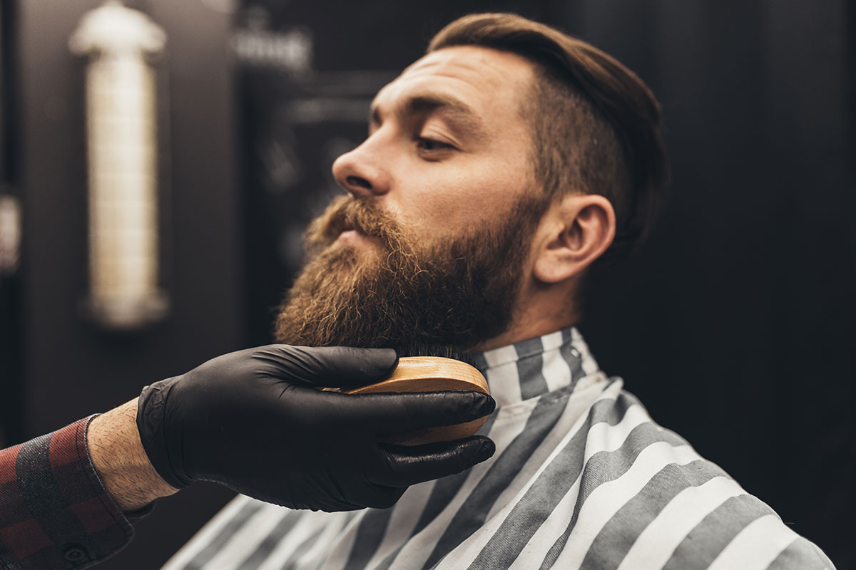 man in barbershop getting trimmed