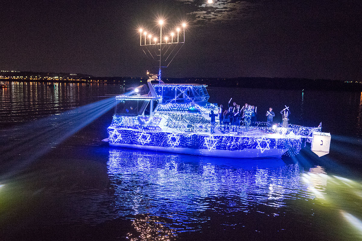 menorah on lit up boat