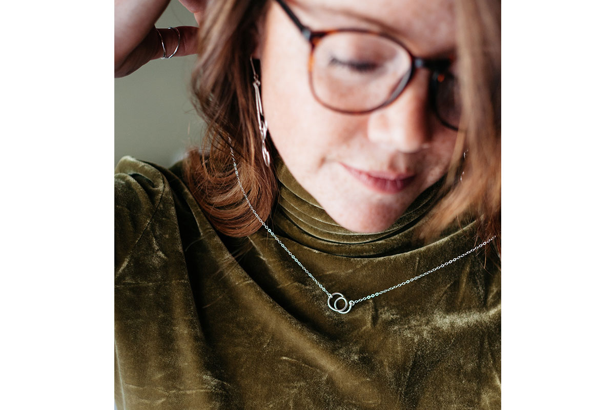 women with glasses and jewelry