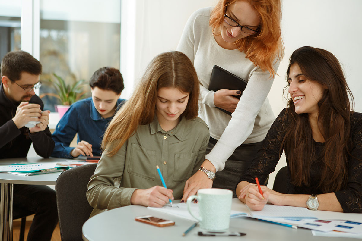 two women learning from teacher