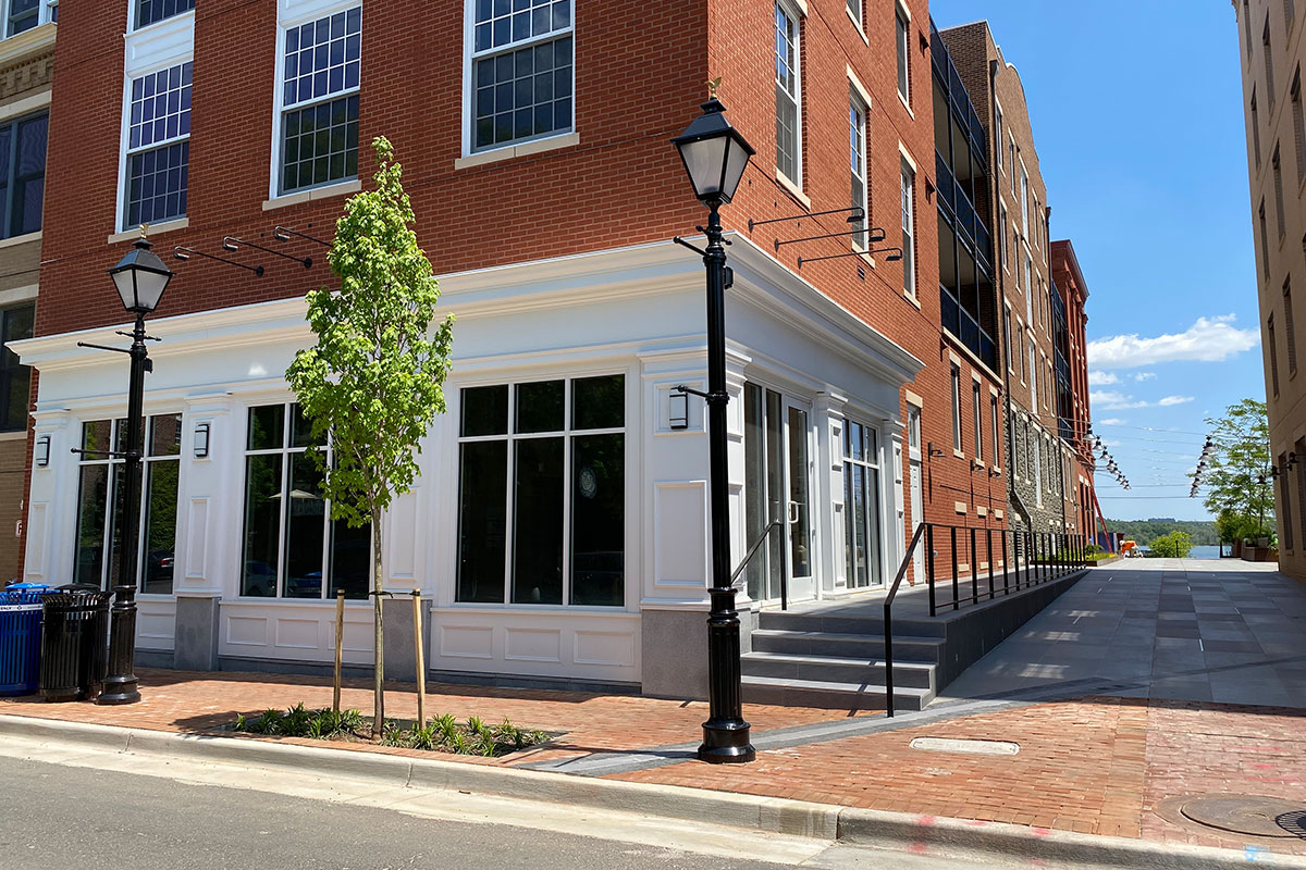 brick and white building of monte durham's new salon