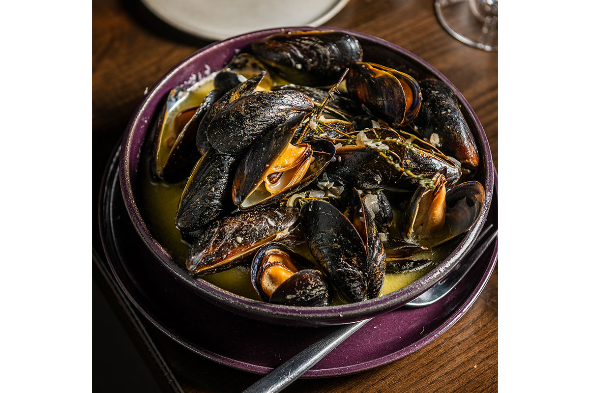 mussels in purple bowl